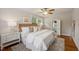 Calming bedroom with neutral colors, natural light, and two bedside tables and lamps at 1105 Englewood Ave, Durham, NC 27701