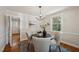 Cozy dining area with round table, seating, and view of the entry and front door at 1105 Englewood Ave, Durham, NC 27701