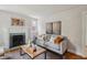 Inviting living room featuring a decorative fireplace, modern furnishings, and ample natural light at 1105 Englewood Ave, Durham, NC 27701