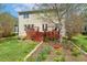 Expansive backyard featuring a multi-level deck, perfect for outdoor relaxation and gatherings at 1127 Woodlands Creek Way, Apex, NC 27502