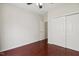Vacant bedroom with hardwood floors and a large closet, awaiting a personal touch at 1127 Woodlands Creek Way, Apex, NC 27502