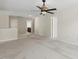 The bonus room has neutral carpeting and a ceiling fan, offering versatility for various activities at 1127 Woodlands Creek Way, Apex, NC 27502