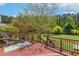 Enjoy the outdoor deck that features chairs and greenery at 1127 Woodlands Creek Way, Apex, NC 27502
