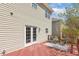 Cozy back deck featuring wood railing, seating, and a stylish outdoor rug at 1127 Woodlands Creek Way, Apex, NC 27502