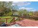 Well-maintained deck space for outdoor entertaining, with a view of the spacious backyard at 1127 Woodlands Creek Way, Apex, NC 27502