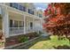 Inviting covered front porch with white railing, offering a cozy spot to relax and enjoy the outdoors at 1127 Woodlands Creek Way, Apex, NC 27502