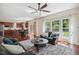 Inviting living room showcasing the open floor plan and natural light, connecting indoor and outdoor spaces at 1127 Woodlands Creek Way, Apex, NC 27502