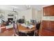 Open-concept dining area, kitchen, and living room with fireplace and ample seating at 1127 Woodlands Creek Way, Apex, NC 27502
