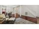 Inviting living space with hardwood floors, comfortable seating, and an open view to the dining area at 1127 Woodlands Creek Way, Apex, NC 27502