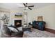 Cozy living room with a fireplace, and natural lighting for a warm ambiance at 1127 Woodlands Creek Way, Apex, NC 27502