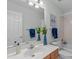 This bathroom has a white counter top and a large mirror at 113 Weatherhill Pt, Carrboro, NC 27510