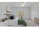 Comfortable bedroom with plush bed, decorative pillows, and a window providing natural light at 113 Weatherhill Pt, Carrboro, NC 27510