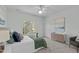 Bright bedroom with a large window, ceiling fan, and comfortable decor at 113 Weatherhill Pt, Carrboro, NC 27510