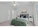 This bright bedroom has a large bed, walk in closet, and green accents at 113 Weatherhill Pt, Carrboro, NC 27510