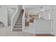 Open floor plan showcasing the staircase, kitchen, and dining area, creating a seamless flow at 113 Weatherhill Pt, Carrboro, NC 27510