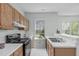 Efficient kitchen layout featuring ample counter space, modern appliances, and natural light at 113 Weatherhill Pt, Carrboro, NC 27510