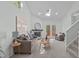 Cozy living room with fireplace, plush seating, skylight, and access to outdoor living space at 113 Weatherhill Pt, Carrboro, NC 27510