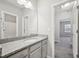 Bright bathroom features a granite vanity and modern fixtures at 1217 Neighborly Way, Morrisville, NC 27560