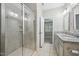 Bright bathroom with glass shower and granite double sink vanity at 1217 Neighborly Way, Morrisville, NC 27560