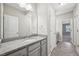 Bathroom featuring granite vanity, modern fixtures, and tiled floors at 1217 Neighborly Way, Morrisville, NC 27560