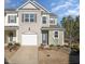Inviting two-story home with a brick-accented facade and attached garage at 1217 Neighborly Way, Morrisville, NC 27560