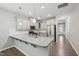 Contemporary kitchen featuring granite counters, stainless appliances, and ample lighting at 1217 Neighborly Way, Morrisville, NC 27560
