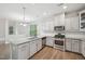Spacious kitchen featuring granite counters, stainless appliances, and ample cabinets at 1217 Neighborly Way, Morrisville, NC 27560