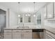 Open kitchen with granite counters and stainless steel appliances with adjoining room at 1217 Neighborly Way, Morrisville, NC 27560
