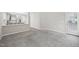 Open-concept living room with neutral carpet and access to the kitchen, perfect for entertaining at 1217 Neighborly Way, Morrisville, NC 27560