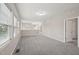 Open loft space with neutral carpeting and plenty of natural light, perfect for a flexible living area at 1217 Neighborly Way, Morrisville, NC 27560