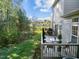 Outdoor deck overlooking the spacious yard and trees beyond at 1322 Pebble Creek Xing, Durham, NC 27713
