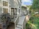Relaxing outdoor space showcasing a wooden deck with gray railings and backyard seating area at 1322 Pebble Creek Xing, Durham, NC 27713