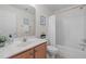 Well-lit bathroom featuring a vanity with wooden cabinets and a shower-tub combination at 1322 Pebble Creek Xing, Durham, NC 27713