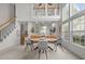 Charming dining area with a modern table setting, complemented by natural light and neutral tones at 1322 Pebble Creek Xing, Durham, NC 27713