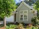 Attractive single-Gathering home with meticulous landscaping, light siding and a beautiful shade tree at 1322 Pebble Creek Xing, Durham, NC 27713