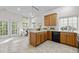 Well-lit kitchen featuring wooden cabinetry and a cozy breakfast nook with plenty of natural light at 1322 Pebble Creek Xing, Durham, NC 27713