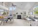 A well-lit living room featuring a fireplace, high ceilings, and open layout, perfect for entertaining at 1322 Pebble Creek Xing, Durham, NC 27713