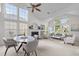 Bright and airy living space with high ceilings, a fireplace, and ample seating with modern decor at 1322 Pebble Creek Xing, Durham, NC 27713