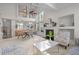 Bright living room with large windows, fireplace, and elegant decor provides a welcoming atmosphere at 1322 Pebble Creek Xing, Durham, NC 27713