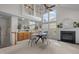 Bright living room with a fireplace, large windows, and open layout creates an inviting space at 1322 Pebble Creek Xing, Durham, NC 27713