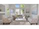 Cozy living room with a large front window, comfortable seating, and elegant decor at 1322 Pebble Creek Xing, Durham, NC 27713
