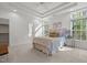 Bright main bedroom with tray ceiling and large windows at 1322 Pebble Creek Xing, Durham, NC 27713