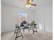 Functional office space featuring a desk, chair, ceiling fan, and a closet at 1322 Pebble Creek Xing, Durham, NC 27713