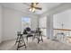 Functional office space featuring a desk, chair, ceiling fan, and a window view at 1322 Pebble Creek Xing, Durham, NC 27713