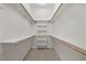 Walk-in closet with carpet and shelving at 1322 Pebble Creek Xing, Durham, NC 27713