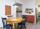 Inviting dining area with a wooden table, seamlessly connects to the kitchen for easy entertaining at 140 Clear Water Rd, Louisburg, NC 27549