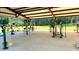 Outdoor exercise area with various machines under a covered structure, ideal for community fitness at 140 Clear Water Rd, Louisburg, NC 27549