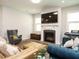 Inviting living room features a fireplace and comfortable seating arrangements perfect for relaxation and entertaining at 140 Clear Water Rd, Louisburg, NC 27549
