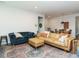 Spacious living room featuring hardwood floors, comfortable seating, and ample natural light at 140 Clear Water Rd, Louisburg, NC 27549