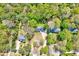 Aerial view of the home and surrounding wooded area at 1433 Andersonwood Dr, Fuquay Varina, NC 27526